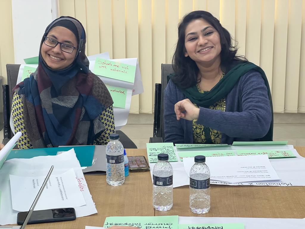 Two people taking part in an evidence cafe