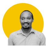 Person posing for a camera in front of a yellow background
