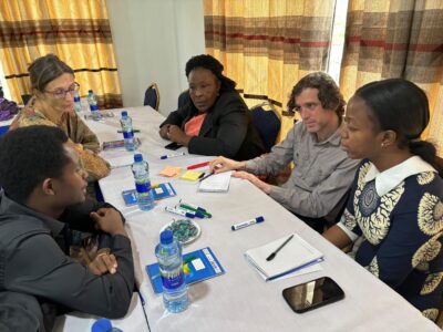 photo of stakeholders in Tanzania sitting in a meeting